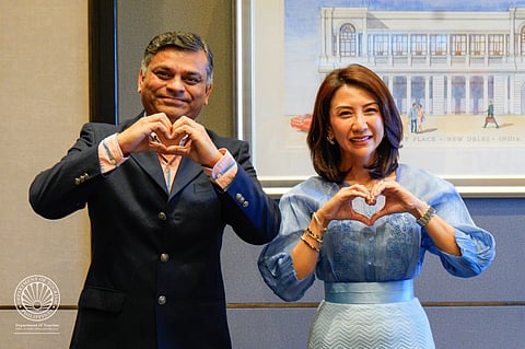 Department of Tourism Secretary Christina Garcia Frasco (right) with Bollyland Executive Producer Yogesh Salgarkar posed for the iconic “Love The Philippines” hand gesture.
