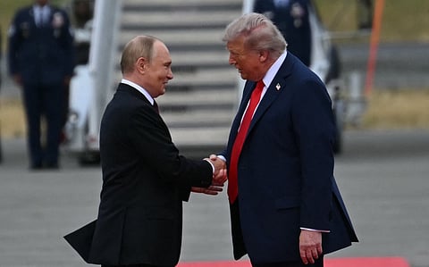 Trump, Putin shake hands at start of Alaska summit
