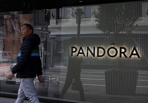 SAN FRANCISCO, CALIFORNIA - MAY 08: A pedestrian walks by a Pandora jewelry store on May 08, 2025 in San Francisco, California. Danish jewelry chain Pandora is warning of significant price increases if the Trump administration's proposed tariffs are enacted. Most of Pandora's jewelry is made in Thailand, Vietnam, India, and China. 