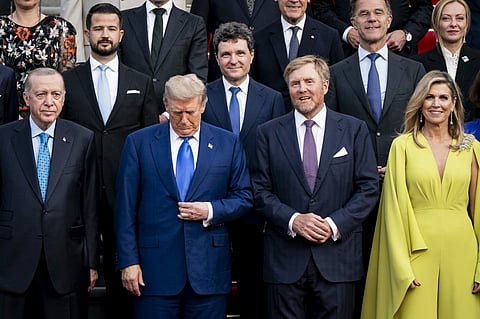 (FILES) NATO country leaders, Turkey's President Recep Tayyip Erdogan (L), US President Donald Trump (2ndL), NATO Secretary General Mark Rutte (Rear 2ndR), Italy's Prime Minister Giorgia Meloni (Top R) pose with King Willem-Alexander (2ndR) and Queen Maxima (R) of the Netherlands for a family photo as they attend a social dinner at the 'Huis ten Bosch' Royal Palace during a North Atlantic Treaty Organization (NATO) Heads of State and Government summit in The Hague, on June 24, 2025. NATO leaders hold a two-day summit on June 24 and 25 in The Hague.
