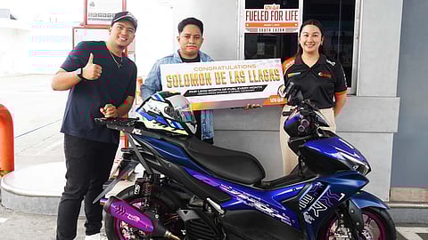 SOLOMON de las Llagas receives his grand prize as the motorcycle category winner of Unioil’s Fueled for Life Challenge.