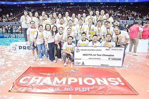 PLDT players, coaches and team executives celebrate after beating Chery Tiggo in five sets to rule the PVL On Tour late Sunday at the Mall of Asia Arena in Pasay City. 