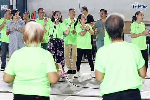 Barangay San Antonio, in partnership with the Rizal Medical Center Geriatric Care Center, held a wellness activity for seniors to promote physical and mental well-being, underscoring the community’s commitment to fostering healthier and happier lives for the elderly. In the photo, senior citizens of Barangay San Antonio, Pasig City, showcase their creativity and vitality as they paint bags and join physical activities during the first anniversary of the Elderly Day Care Program.