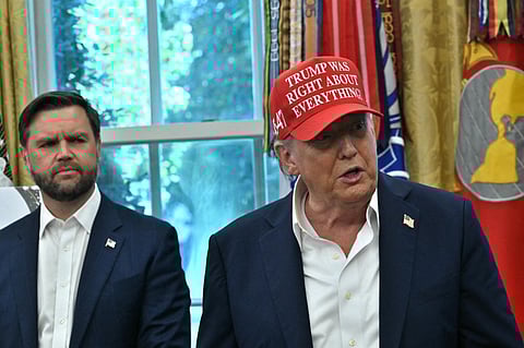 US President Donald Trump makes an announcement from the Oval Office of the White House in Washington, DC, on August 22, 2025 as Vice President JD Vance looks on. Trump announced the 2026 World Cup draw will be held on December 5 at Washington's Kennedy Center.
