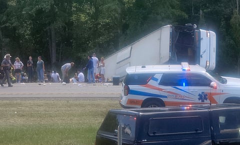 VICTIMS and emergency personnel respond at the scene of a tragic bus crash on Interstate 90 near Pembroke, New York, on Friday. Five passengers lost their lives after the bus driver reportedly became distracted, authorities said.