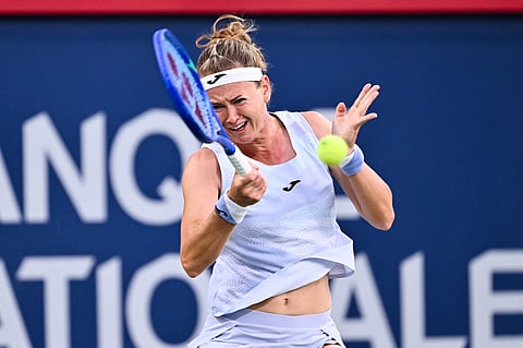  Marie Bouzkova of Czechia plays a forehand against Victoria Mboko of Canada during their third round match on Day Five of the WTA 1000 National Bank Open at IGA Stadium on July 31, 2025 in Montreal, Quebec, Canada.