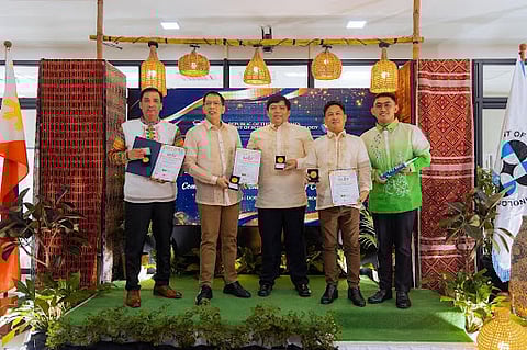 From left to right: Ronald Pagsanghan, inventor of the Unsinkable PortaBoat; Richard Nixon Gomez and his son, Rigel Gomez, co-inventors of Sambacur Plus; Jefferson Chong, creator of the Sultana Digital Rice Vendo Machine; and Mark Kennedy Bantugon, innovator behind Pili Adheseal, during a commendation ceremony held at the DOST Central Office in Bicutan, Taguig City, on August 19, 2025. 
