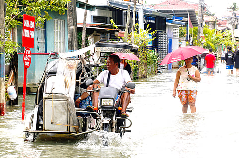 A modified tricycle called tikling ferries residents to the provincial road. Unlike ordinary tricycles, tiklings are taller and can wade through deeper waters. The fare costs between P40 and P50.