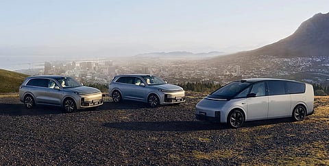 THE Li Auto L7, L9, and MEGA stand side by side on a ridge overlooking the city, capturing the brand’s vision of family travel.