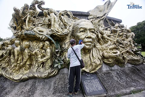 A caretaker cleans the two-sided mural sculpture of Philippine heroine Tandang Sora, known as the “Grand Old Lady of the Philippine Revolution,” who cared for wounded revolutionaries during the struggle for independence. The mural is located inside Himlayang Pilipino Memorial Park in Quezon City, where the tribute was done on Monday, 25 August 2025, as the nation marked National Heroes Day.