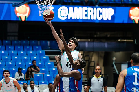 #44 Alex Negrete of Argentina drives into the basket, #1 Juan Suero of Dominican Republic trying to intercept.