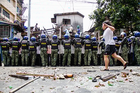 Tension rises amid demolition in Barangay 227, Jose Abad Santos Avenue in Tondo, Manila, on 28 August 2025, as residents clash with the demolition team and police officers. 