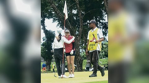 Johanna Blair Uyking and Nicole Gaisano Gan embrace after their tense quarterfinal match in the Philippine Amateur Open Championship at Apo Golf and Country Club in Davao City on Friday.