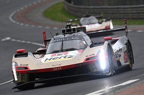 CADILLAC Hertz Team Jota’s British driver #12 Will Stevens (front) steers his hypercar in front of Cadillac Hertz Team Jota’s New Zealand driver #38 Earl Bamber during the 2025 Le Mans 24-hour endurance race, at the Le Mans circuit, in north-western France.