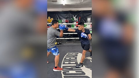 Jayson Vayson, who left Manila a few days ago, buckles down to work in Las Vegas with help from resident trainer Joven Jimenez.