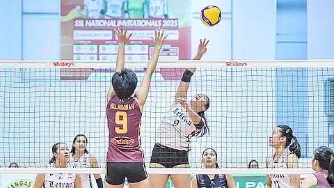 Joralyn Panangin of Letran pushes a lob over the block of Alaiza Malabanan of University of Batangas during their 2025 SSL National Invitationals Batangas Leg match.