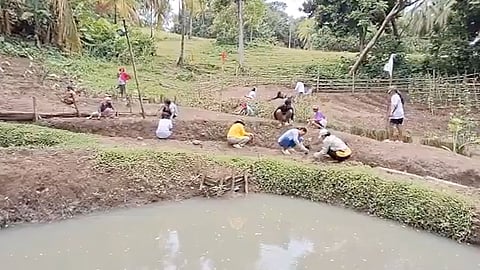 LOCAL farmers prepare land for planting vegetables in Barangay Cawitan. 