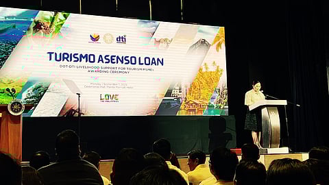 Trade Secretary Cristina Roque delivers a speech during the launch of the ‘Turismo Asenso Loan Program’ at the Marriott Hotel in Pasay City on Monday.