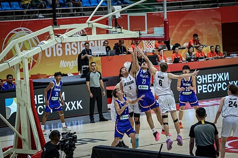 MARK Jello Lumagub of the Philippines shoots over the outstretched arms of Lincoln Wilson and Elijah Tuupo of New Zealand during their FIBA U16 Asia Cup game yesterday in Mongolia, The Kiwis prevailed 85-54.