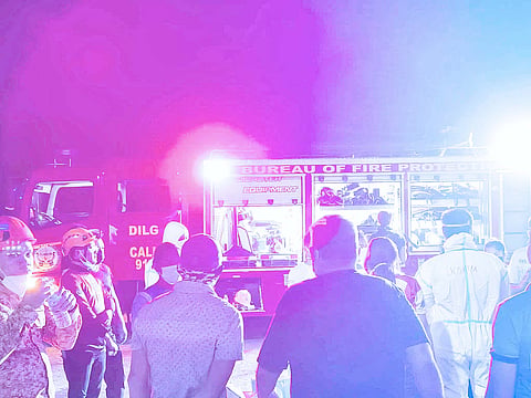 Members of the Local Disaster Risk Reduction and Management Office of Talisay City, Cebu respond to the explosion incident at a resort in Barangay Pooc on Tuesday evening. 
