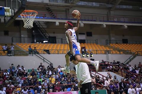 SHEAN Jackson soars over Marc Pingris to rule the Slam Dunk Contest during the MPBL All-Star Weekend on Saturday at the Alonte Sports Arena in Biñan, Laguna.