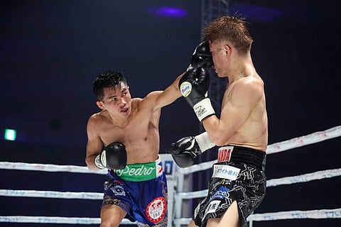 Pedro Taduran (left) smashes his way to a brutal beating of Japanese Ginjiro Shigeoka last May in Osaka.