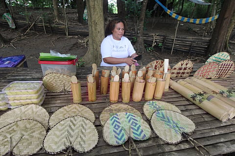 Beautiful items such as fans, utensils, and coin banks are displayed at a table at the entrance of the tree nursery of the Pastolan Village in Subic Bay Freeport on Wednesday. These beautiful crafts made from locally sourced materials were made by Aeta artisans of the Pastolan Village. 