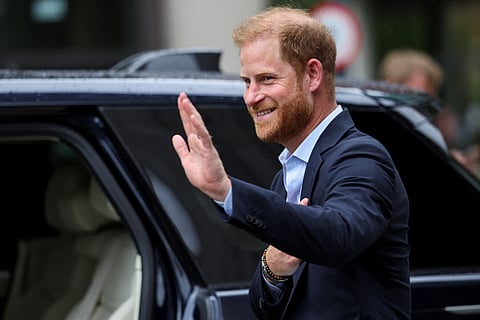 Britain's Prince Harry, Duke of Sussex waves as he departs the Centre for Blast Injury Studies, at the Imperial College in London, on September 10, 2025.