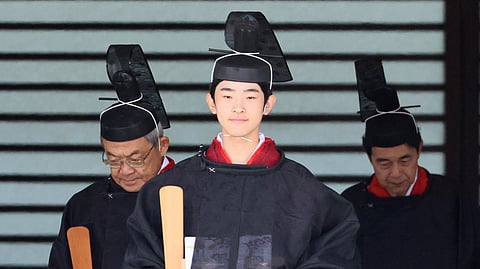 Japanese Prince Hisahito, son of Crown Prince Akishino wearing an ancient ceremonial costume, leaves for a ceremony by a carriage at the Imperial Palace in Tokyo on September 6, 2025. Japan on September 6 heralded the coming-of-age of Prince Hisahito with an elaborate ceremony at the Imperial Palace, where a succession crisis is brewing.