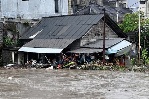 A house is inundated by floodwaters following heavy rain in Denpasar, Indonesia's Bali island, on September 10, 2025.

