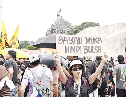 ABOUT 300 protesters gather at the People Power Monument along EDSA to express outrage over the billions of pesos allegedly skimmed off the government’s flood control projects.