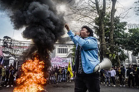 (FILES) A demonstrator shouts slogans during a protest demanding police reform and the dissolution of the parliament, in Bandung, West Java on September 1, 2025. In removing Indonesia's finance minister and U-turning on protester demands, the leader of Southeast Asia's biggest economy is scrambling to restore public trust while seizing a chance to install loyalists after deadly riots last month, experts say.
