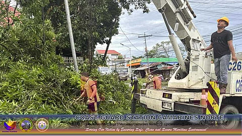 PCG personnel conduct a clearing operation after a tornado hit Daet, Camarines Norte on September 14, 2025.