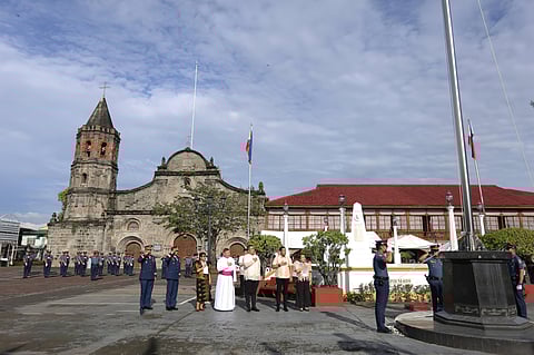 Officials from the local government of Malolos City in Bulacan celebrate the 127th anniversary of the opening of the Malolos Congress at the Barasoain Church Historical Landmark on Monday.