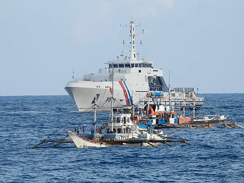 Aid trips Philippine Coast Guard and Bureau of Fisheries and Aquatic Resources personnel support Filipino fishermen in the Bajo de Masinloc, where Chinese vessels had been engaged in aggressive maneuvers.