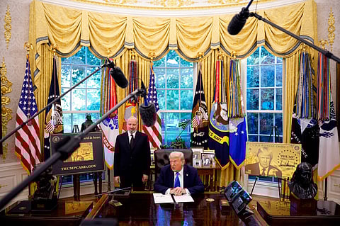 WASHINGTON, DC - SEPTEMBER 19: President Donald Trump, accompanied by U.S. Commerce Secretary Howard Lutnick (L), speaks after signing an executive order in the Oval Office at the White House on September 19, 2025 in Washington, DC. Trump signed two executive orders, establishing the "Trump Gold Card" and introducing a $100,000 fee for H-1B visas. The "Trump Gold Card" is a visa program that allows foreign nationals permanent residency and a pathway to U.S. citizenship for a $1 million investment in the United States. 