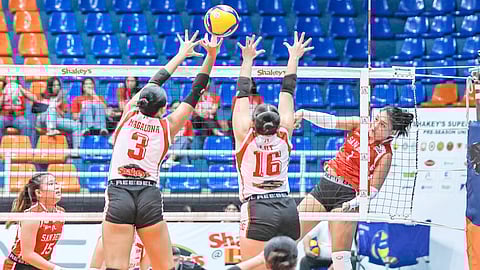 ANGEL Habacon of San Beda scores over the outstretched hands of EAC defenders during their SSL Preseason Unity Cup game on Saturday at the FilOil EcoOil Centre in San Juan.