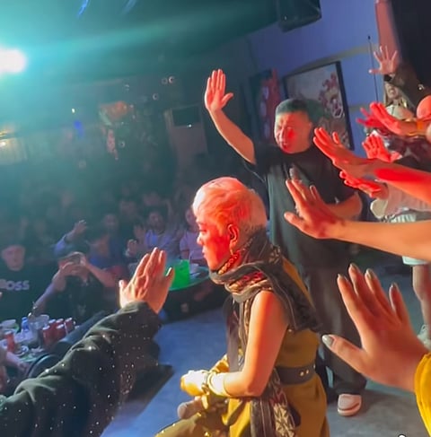 Comedian Ate Gay being orayer over by friends onstage in last nights benefit show