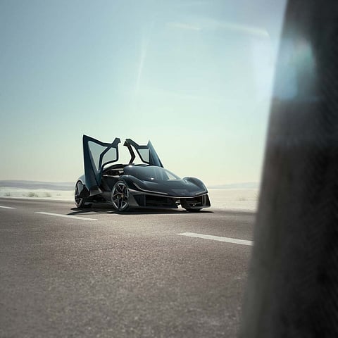 The Theory 1 with its reverse-opening wrap-over doors fully extended on the open road.