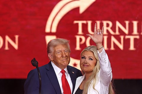 US President Donald Trump and Erika Kirk, Charlie Kirk's widow, gesture during the public memorial service for right-wing activist Charlie Kirk at State Farm Stadium in Glendale, Arizona, on September 21, 2025.
