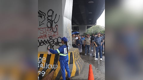 Mayor Francisco ‘Isko Moreno’ Domagoso (right) visits the stretch of Taft Avenue that is being repainted to cover up vandalism during Sunday’s unrest.