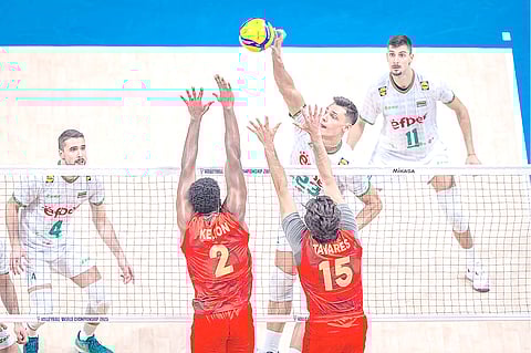 
ALEKSANDAR Nikolov of Bulgaria spikes over the Portuguese defensive wall put up by Eulávio Semedo Kelton and Miguel Tavares in their 2025 FIVB Volleyball Men’s World Championship Round of 16 match. Bulgaria wins in straight sets.