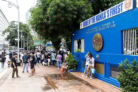 Families, friends and lawyers of individuals who were arrested during Sunday’s anti-corruption protests continue to wait outside the Manila Police District headquarters along UN Avenue in Manila on Tuesday as inquest proceedings are still ongoing. 