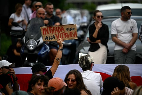 A protester hold a placard reading ‘Antifa till Victory’ as they block the traffic during a protest part of the nationwide strike ‘Let’s Block Everything’ in solidarity with Palestinians in Gaza and calling for a halt to arms shipments to Israel, in Rome.