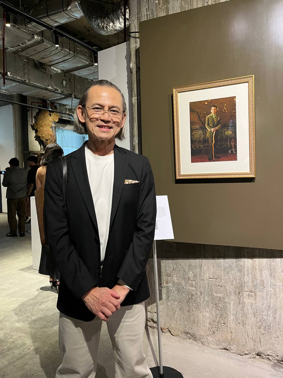 Jon Santos with his portrait. 