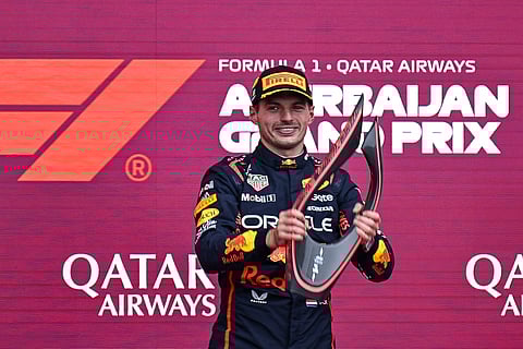 MAX Verstappen celebrates with his trophy on the podium after the Formula One Azerbaijan Grand Prix at the Baku City Circuit in Baku.