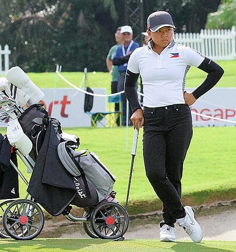 RIANNE Malixi puts herself in early contention after salvaging a two-under-par 70 at the start of the 31st Santo Espiritu Trophy at Tanah Merah Country Club in Singapore on Wednesday.