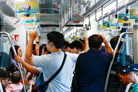 
Commuters of the LRT-1 patiently wait for the train to get to their destinations on Thursday morning. The LRT-1 spans from Fernando Poe Jr. Station on Quezon City to Dr. Santos Station in Parañaque City.