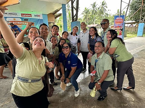 One Meralco Foundation led by its president Jeffrey O. Tarayao together with the teachers during a school electrification program.