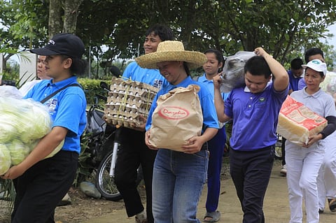 
TZU Chi volunteers bring food supplies for the hot meals of evacuees. 